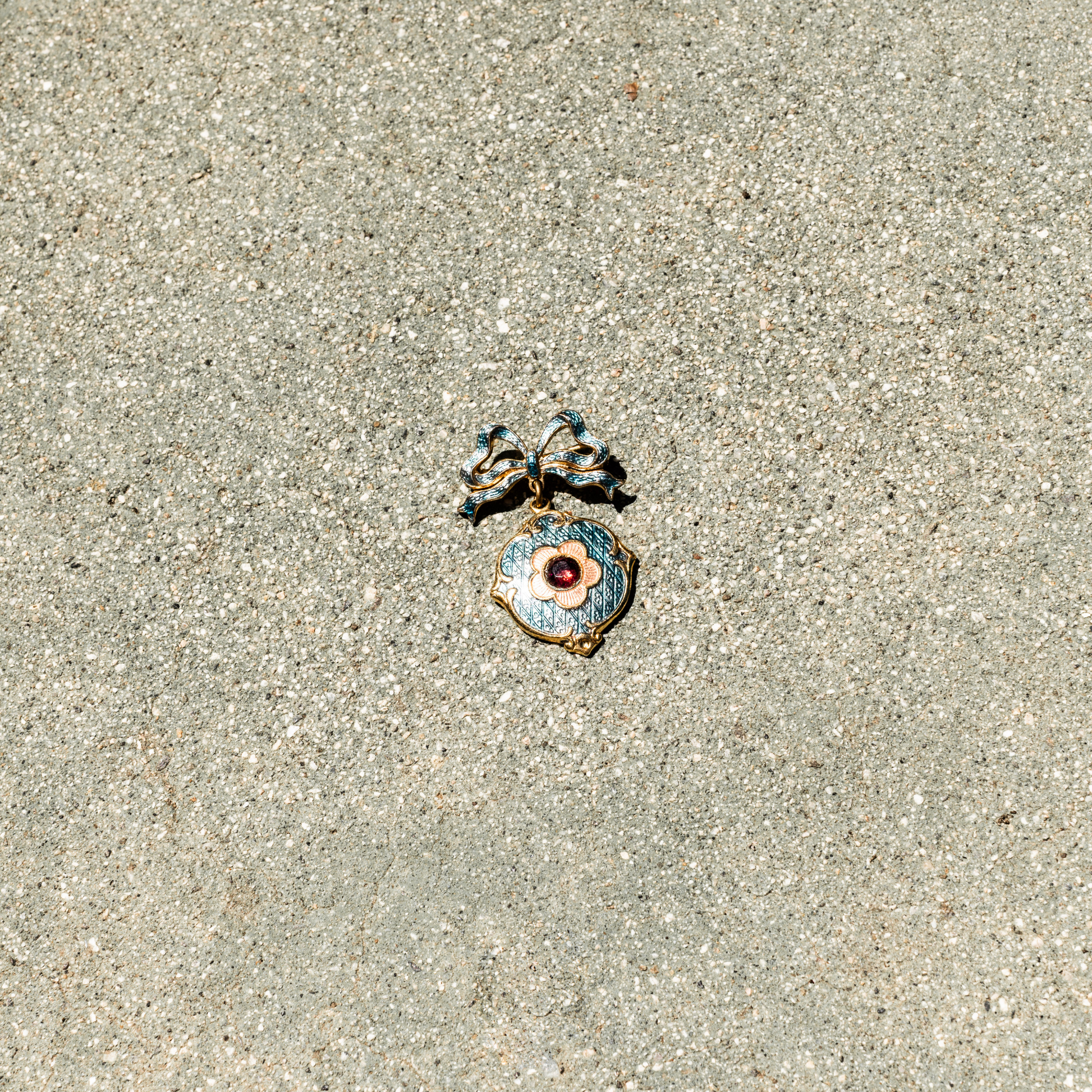 Decorative pendant on a sandy surface