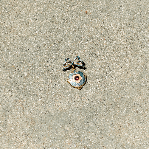 Decorative pendant on a sandy surface
