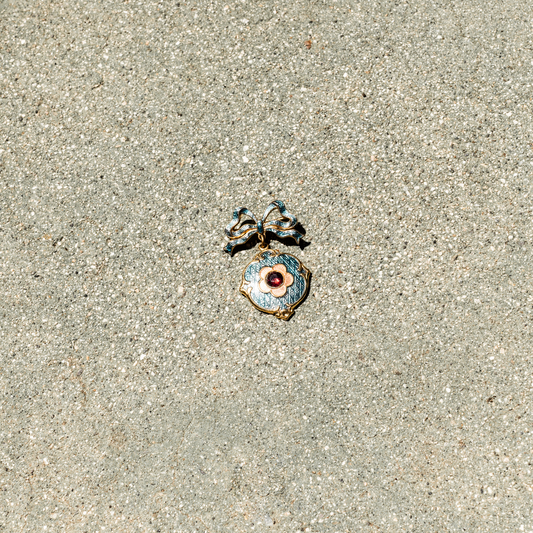 Decorative pendant on a sandy surface