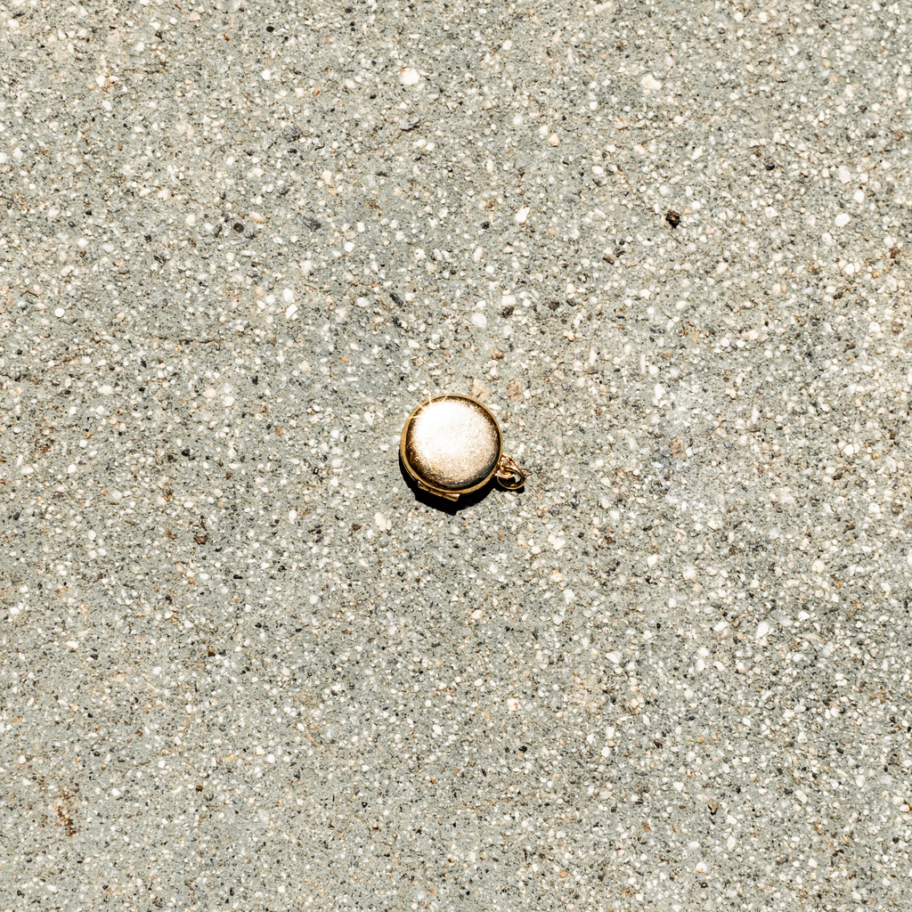 Small round object on sandy ground