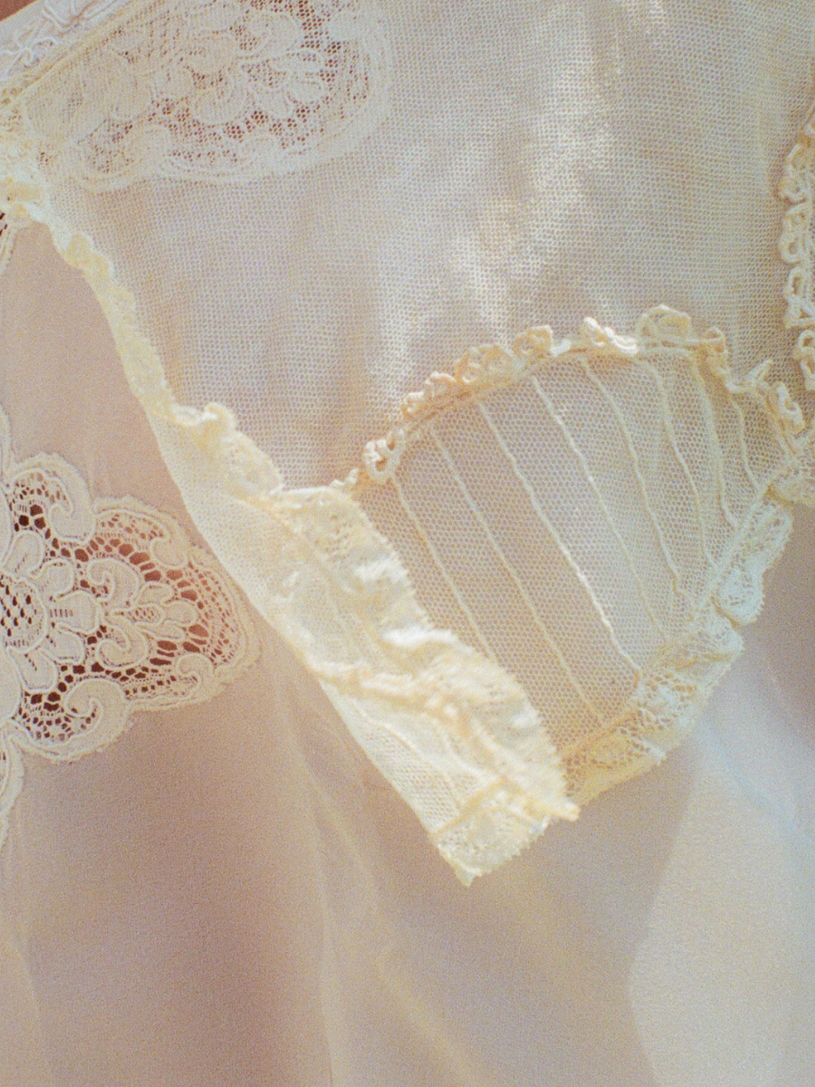 Close-up of lace detailing on a sheer fabric