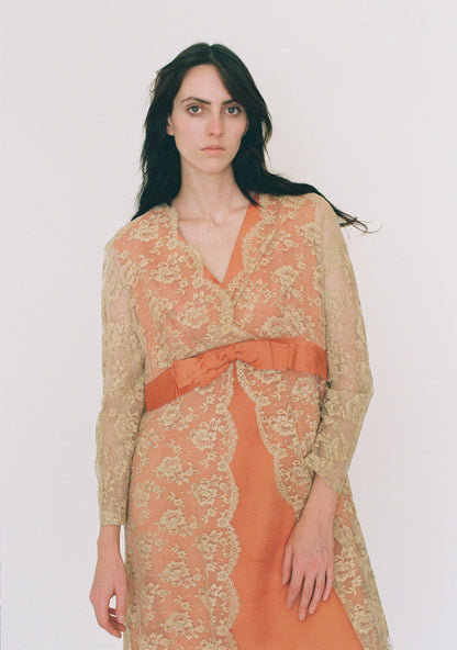 Woman wearing a floral dress with a plain background