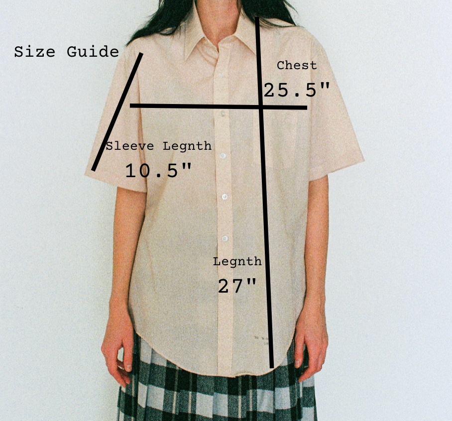 Beige shirt with measurements labeled on a plain background
