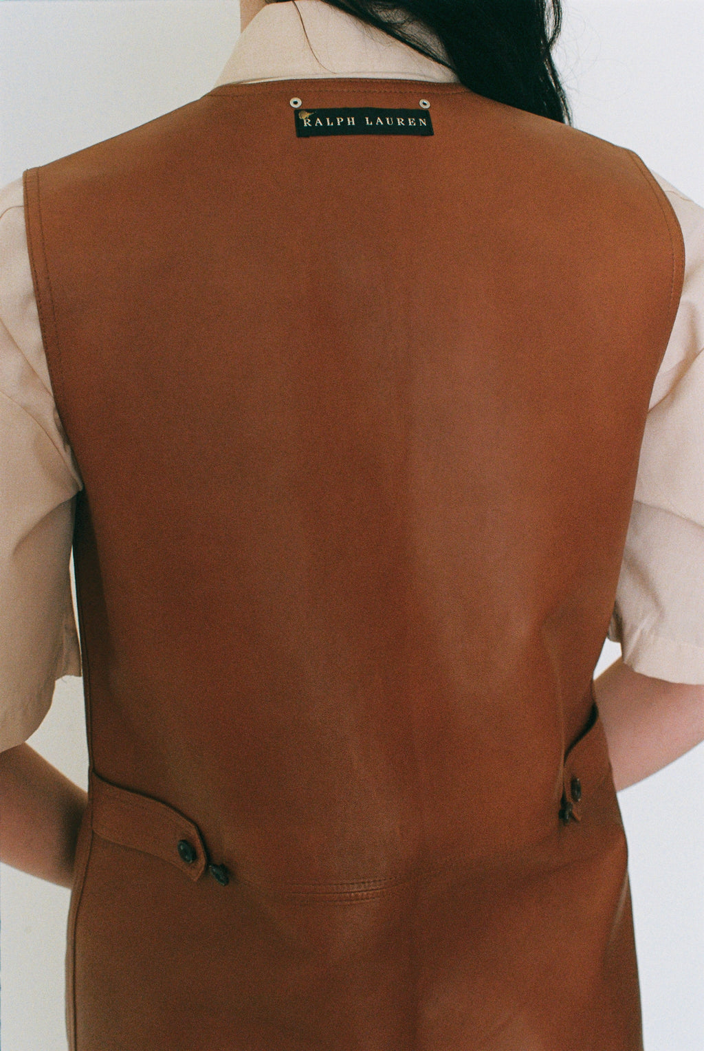 Brown vest with Ralph Lauren logo on a white background