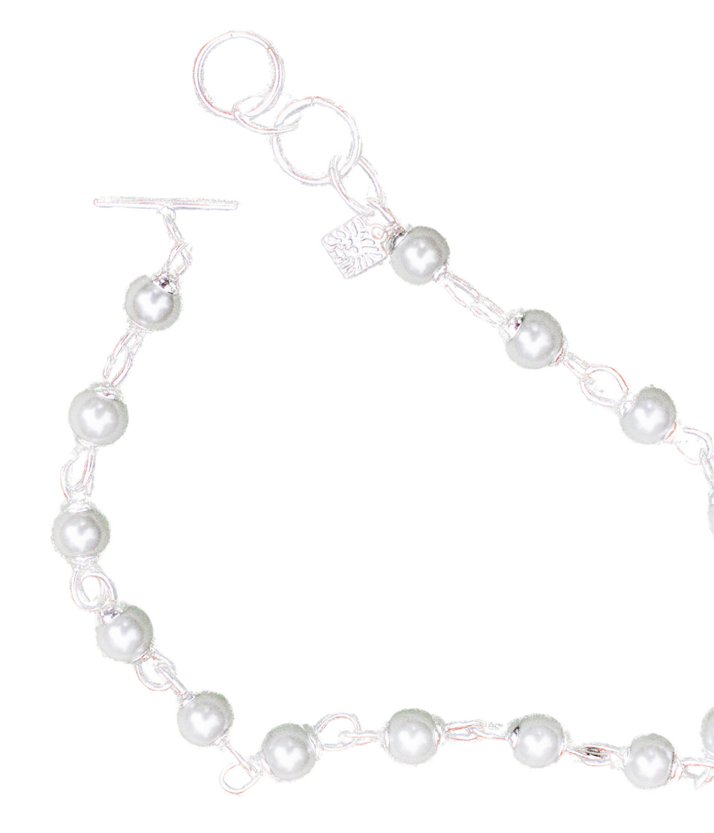 Pearl necklace with silver clasp on a white background