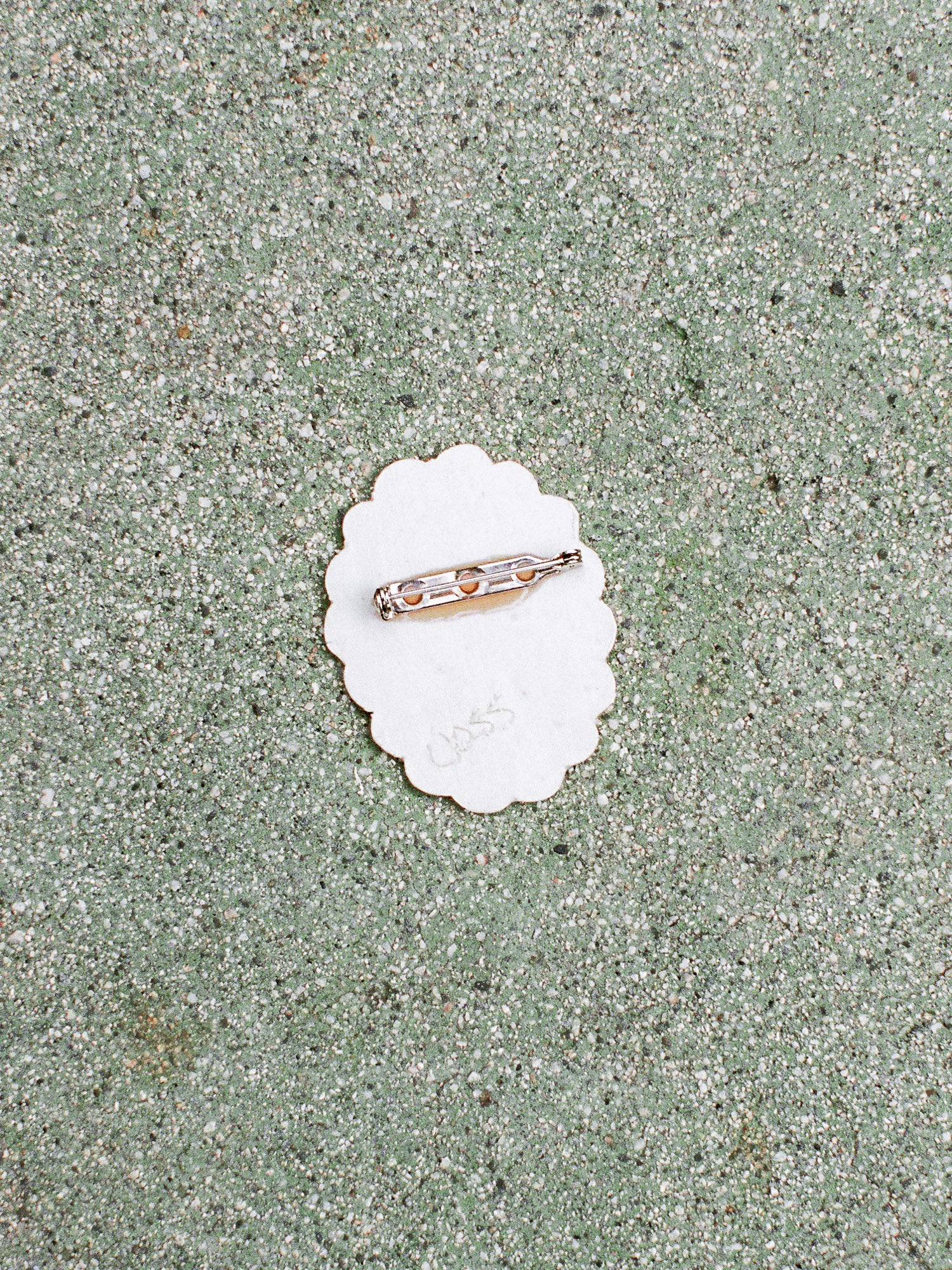 Ring on a white shell with sand background