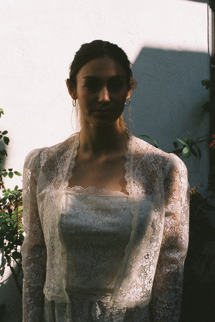 Woman wearing a lace dress with a blurred background