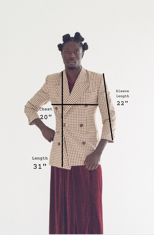 Person wearing a checkered jacket with measurements indicated on a white background