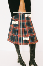 Plaid skirt with measurements labeled on a white background