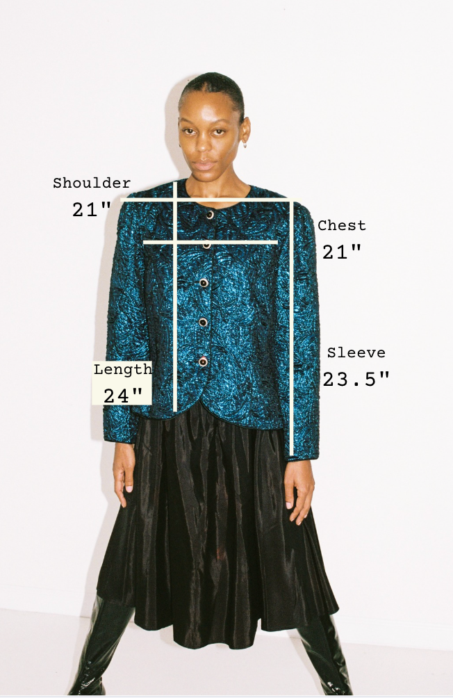 Model wearing a blue sequin jacket with measurements labeled on a white background