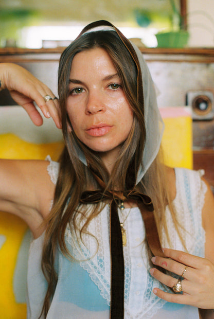Woman with a headscarf in a vintage setting