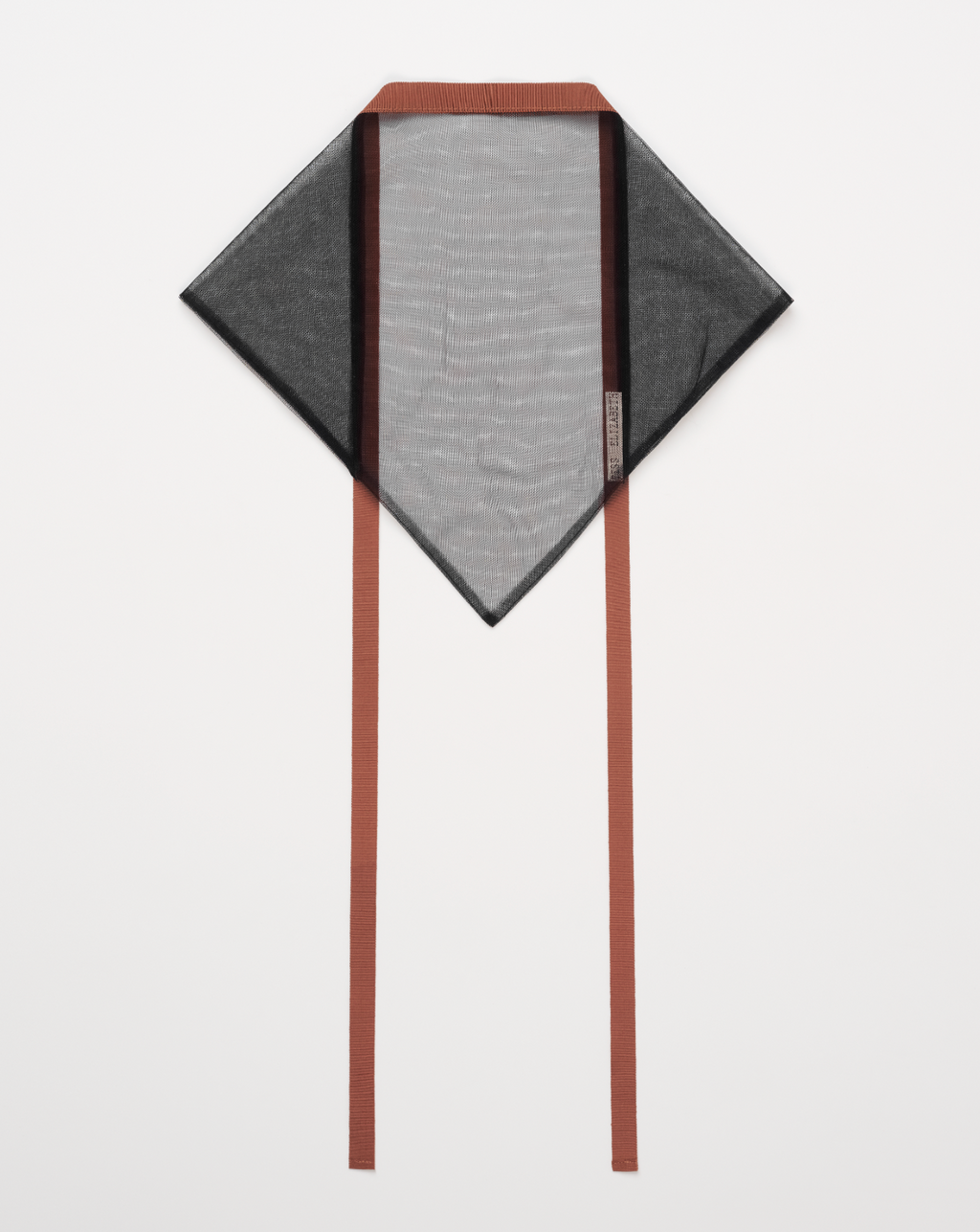 Black mesh headscarf with vintage ribbon trim laying on white background