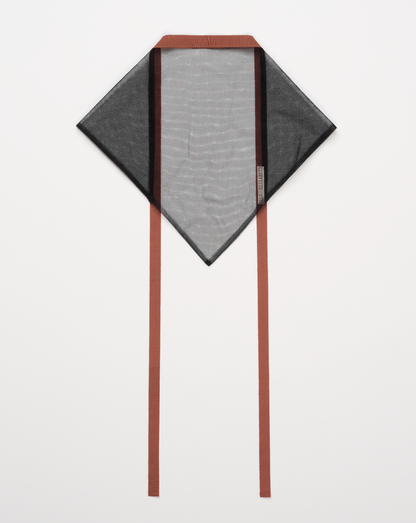 Black mesh headscarf with vintage ribbon trim laying on white background