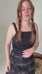 woman wear a vintage plaid skirt
